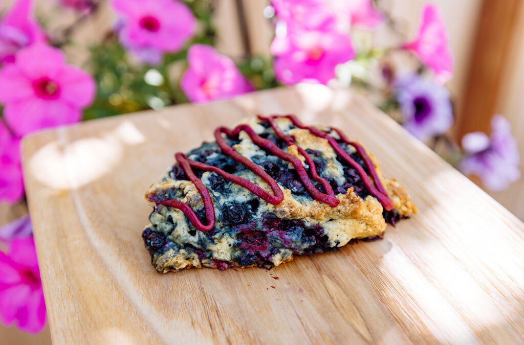 Huckleberry scone topped with homemade huckleberry drizzle